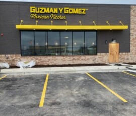 Exterior lighting and signage at Guzman y Gomez