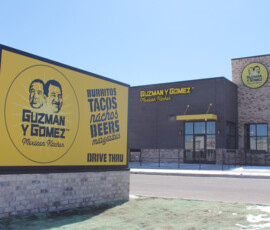 Exterior lighting and signage at Guzman y Gomez