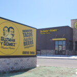 A photo of the exterior sign at Guzmen & Gomez Mexican Kitchen