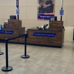 a photo of connected registers and illuminated aisle signs