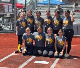 A winning softball team sponsored by Benson